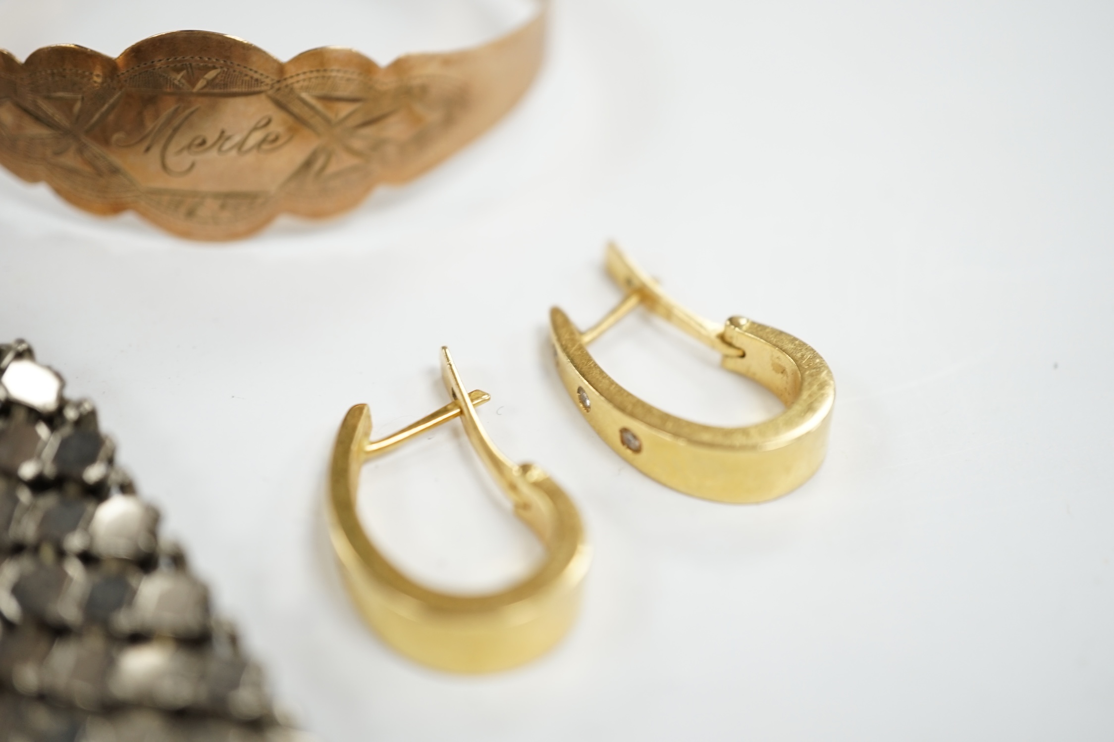 A 9ct gold bracelet inscribed ‘Merle’, a pair of 14k and diamond chip set earrings and an expanding metal purse. Condition - fair